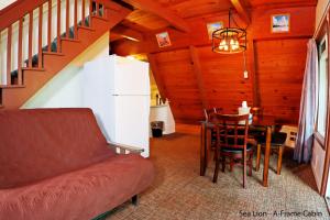 a living room with a couch and a table at Park Motel and Cabins in Florence