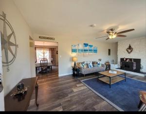 a living room with a couch and a table at Bay Front Manor House in Deale