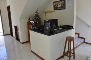 a kitchen with a christmas tree behind a counter at Pousada Mirantes Do Sincorá in Mucugê