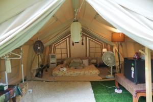 a bedroom with a bed in a tent at Le Rafting & Le Camping in Ban Hin Dan