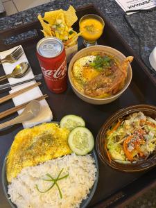 a tray of food with rice and different types of food at Casaroyal Beachfront Siquijor in Siquijor