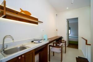a kitchen with a sink and a counter top at AT Homestay Huế in Thôn Lại Thê +45 photos