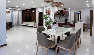 a dining room and kitchen with a table and chairs at Luxury villa Phu Quoc in Phú Quốc