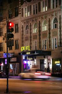 a traffic light in front of a building at night at Acme Hotel Company Chicago in Chicago