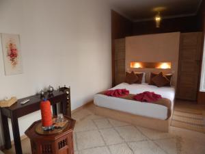 En eller flere senge i et værelse på Riad De Vinci & SPA