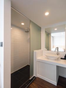 a bathroom with a sink and a mirror at Unplug Anguk in Seoul +70 photos