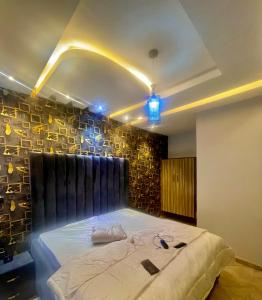 a bedroom with a large bed in a room at Ebest homes in Benin City