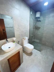a bathroom with a toilet and a sink and a shower at The Chill Heights Ramboda in Ramboda +23 photos