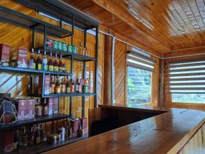 a bar in a cabin with a wooden wall at Sapa Rock Hill Homestay in Tả Van