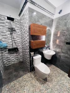 a bathroom with a toilet and a sink at K won Villa in Busse +9 photos