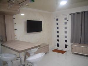 Телевизор и/или развлекательный центр в San San Andrés Casa Vacacional 2 by bbbsai