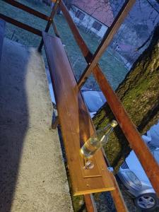 a glass bottle hanging from a wooden structure at Milov konak in Berane +2 photos