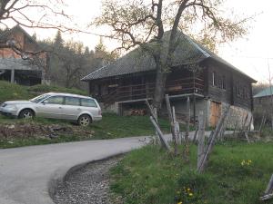 a car parked in front of a house at Milov konak in Berane