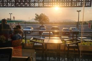 a view from a restaurant with cars parked in a parking lot at Vihari Foodway INN in Gooty