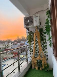 a balcony with a air conditioner on a building at Bunkyard rishikesh in Rishīkesh