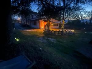 a house at night with lights in the yard at Cuore di Legno Country House in Spoleto