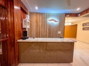 a large kitchen with a counter in a room at Mount kirola stay in Bhowāli +83 photos