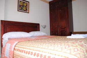 Voodi või voodid majutusasutuse Hotel Caluva toas