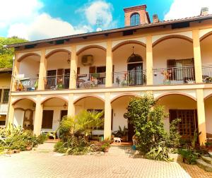 a large building with balconies and plants on it at Bouganville in Viverone