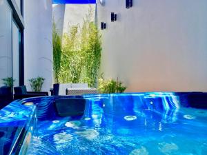 a hot tub in the middle of a room at Private Hot Tub All Year Round - 25 min Lisbon in Setúbal