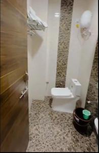a bathroom with a toilet in a room at Zoz jhodpur in Jodhpur +9 photos