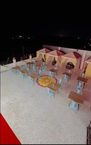 a group of tables and chairs in a room at Zoz jhodpur in Jodhpur