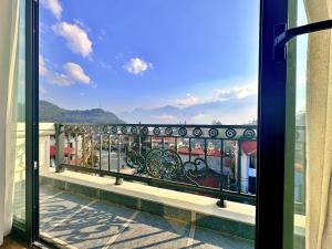 a view from a balcony with a view of a city at Calla Lily Hotel in Sapa