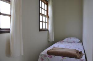 Tempat tidur dalam kamar di Pousada Mirantes Do Sincorá