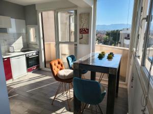 a kitchen with a table and chairs and a window at Apartments Kike&Ana in Split +81 photos