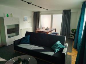 a living room with a couch and a table at Ferienwohnung Oberhof in Murg