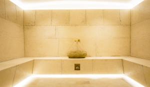a bathtub with a vase sitting on top of it at LOFT Hotel & SPA in Bukovel