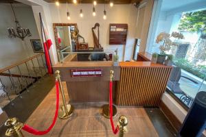 a bar with two red ropes around the front of a room at Windy Ridge Hotel Tagaytay in Tagaytay