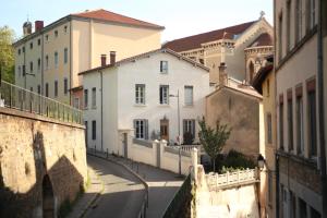 a group of buildings on a city street at Lyon Standing Historic City Apartment in Lyon