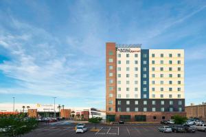 a large building with a parking lot in front of it at Fairfield Inn & Suites by Marriott Nogales in Nogales