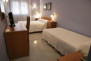 Кровать или кровати в номере Hotel Azpiazu