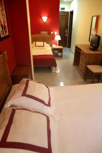 Кровать или кровати в номере Hotel Azpiazu