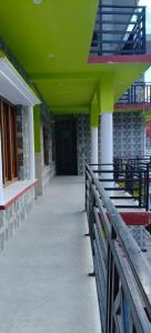 a hallway of a building with a green ceiling at Omji Niwas - Kalindi in Kharsālī