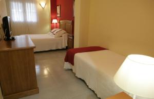 Кровать или кровати в номере Hotel Azpiazu
