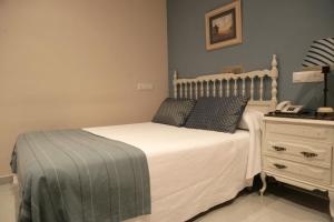 Кровать или кровати в номере Hotel Azpiazu