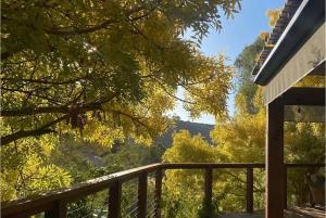 a balcony with a view of the mountains at Bodhi Valley BnB in Golden Grove