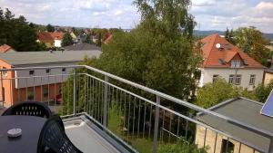 a balcony with a view of a city at Apartment mit Balkon in Dresden +2 photos