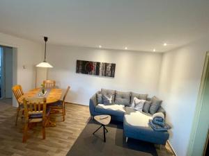 a living room with a couch and a table at Ferienwohnung Mutter in Schluchsee