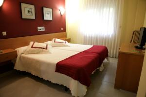 Кровать или кровати в номере Hotel Azpiazu