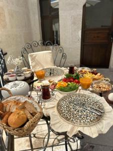a table with bread and other food on it at Sevdalı Konakları in Avanos
