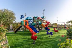 a park with a playground with a slide at Hotel Altura CHHATRAL in Nandāsan