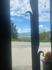 a window with a view of a road and mountains at Estavar in Estavar