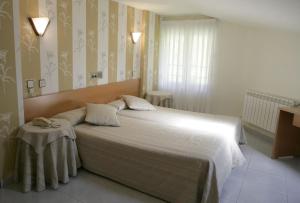 Кровать или кровати в номере Hotel Azpiazu