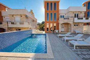 a swimming pool in the middle of a building at Villa Alera in Dobra Voda