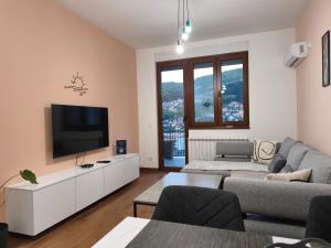 a living room with a flat screen tv on a wall at Narcis in Užice