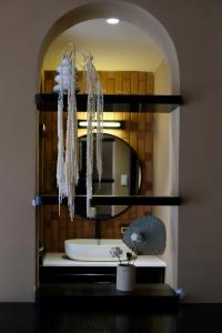 a bathroom with a sink and a mirror at HIDE&SEEK Homestay in Ấp Tân An (1) +37 photos